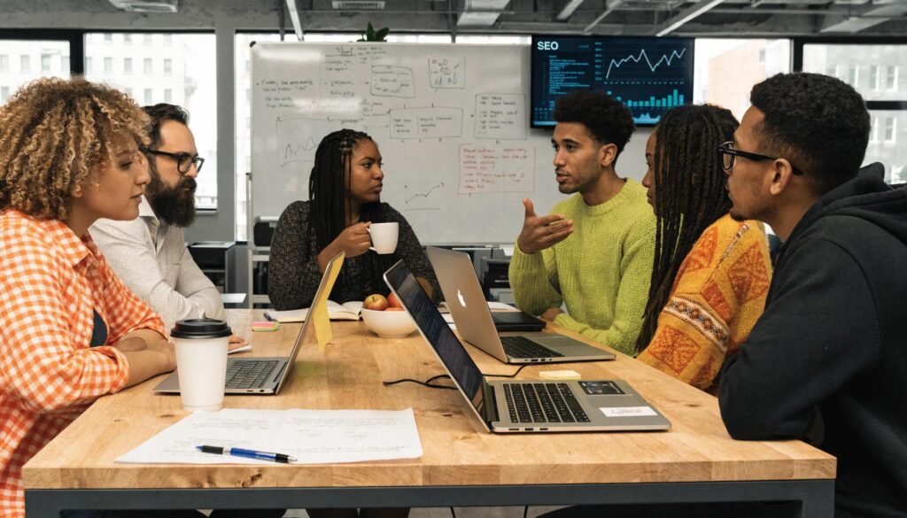 Team of marketing professionals discussing AI-driven SEO strategies in a modern office